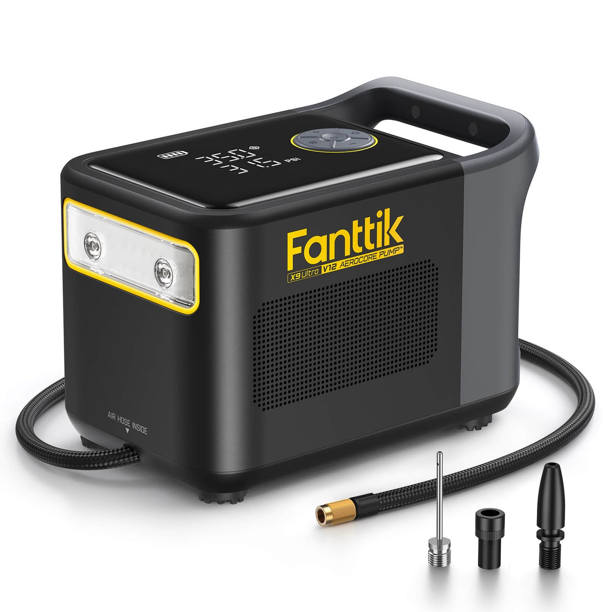 Large black Fanttik X9 Ultra tire inflator seen from above at an angle on a white background, a gray carry handle across the top, a control panel with pressure figures on the top face, a rectangular LED light strip in a yellow bezel on the front left, X9 Ultra V12 AEROCORE PUMP printed in yellow on the front, a braided air hose with a brass fitting and three screw-on adapters lying in front