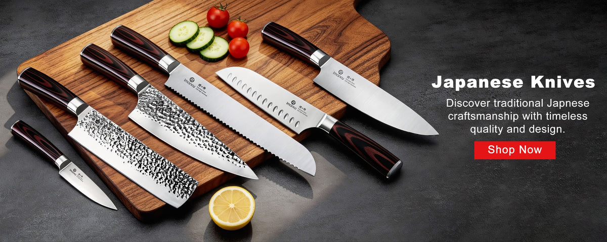 A row of Japanese kitchen knives laid out on a wooden cutting board
