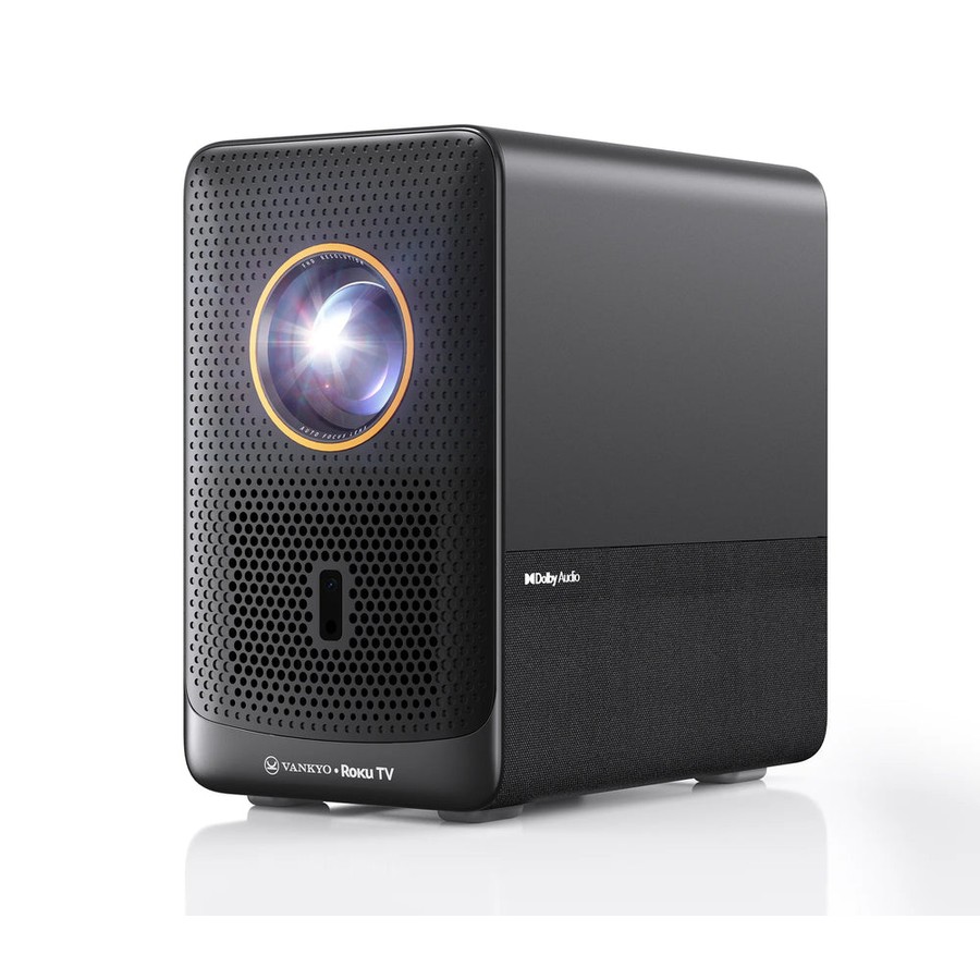 Black rectangular VANKYO projector shown front-three-quarter against a white background; the round lens has a gold trim and sits centered on a perforated front grille, with a Dolby Audio mark on the side panel. The front-base carries a VANKYO logo and 'Roku TV' co-brand wordmark